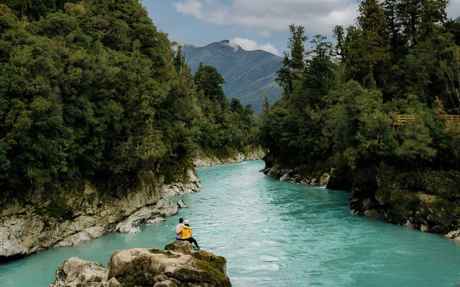 A couple looking at Hokitika Gorge in New Zealand