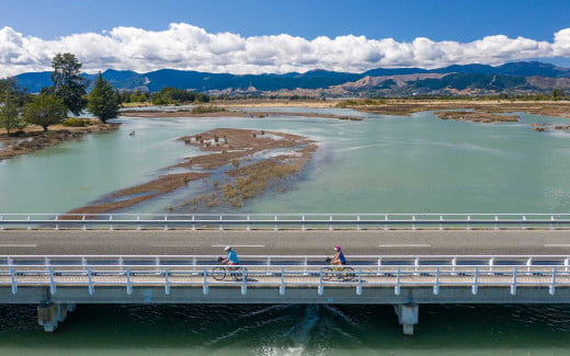Cycling on the Bridge in Rabbit Island, Nelson