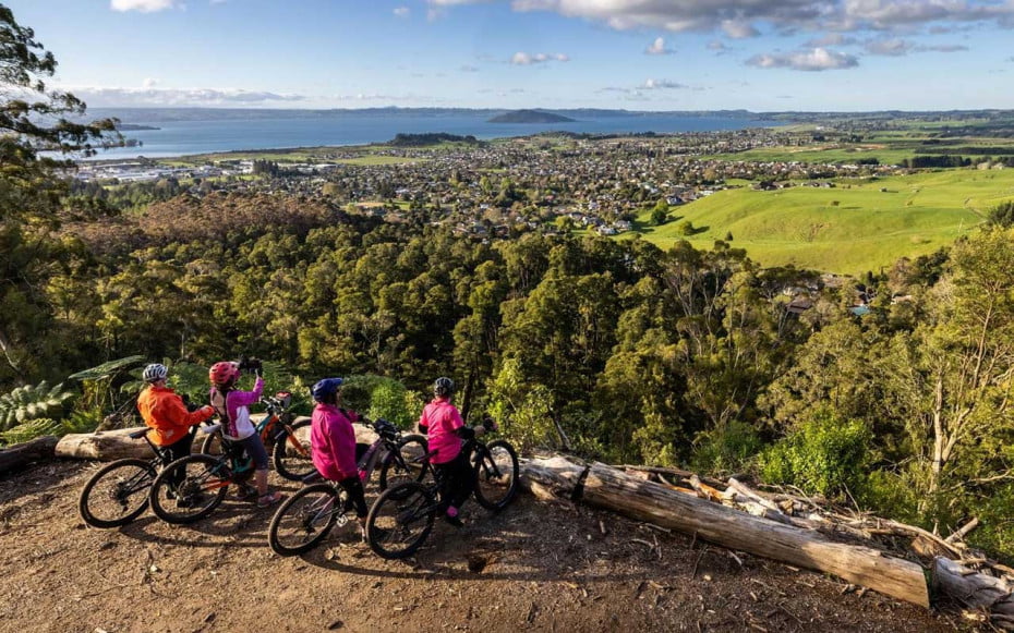 Mountain bikers having a break while on a forest loop in Rotorua, New Zealand