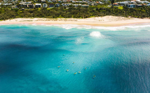 Aerial view of the blue waters of Sunshine Beach in Queensland, Australia