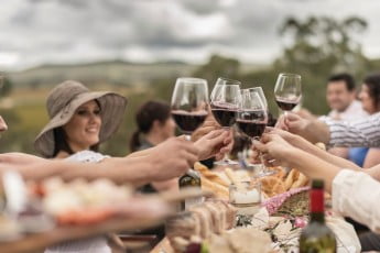 Friends toasting with wine, Novotel Barossa Valley Resort, Adelaide, Australia.