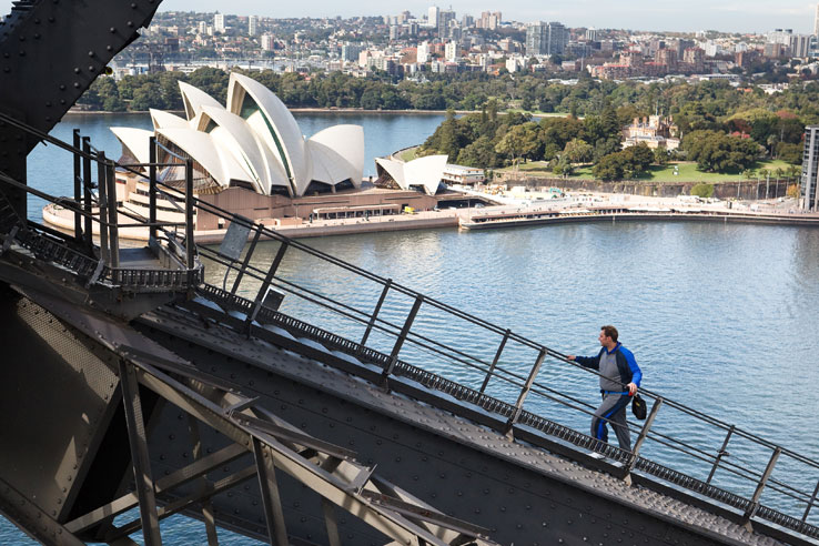 Man climbing Sydney Harbour Bridge, Sydney, Australia.