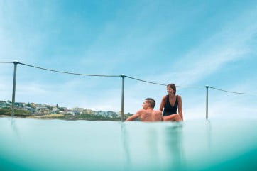 A couple enjoying an ocean pool, Sydney. 