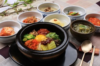 Dolsot bibimbap with banchan (side dishes), South Korea. 