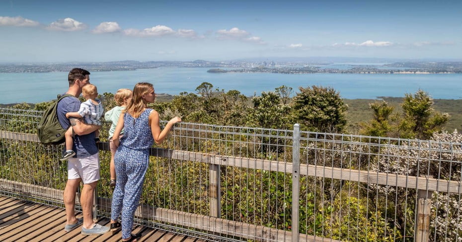 A family admiring the view from the top of Rangitoto. 