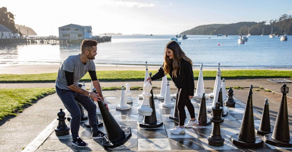 Playing giant chess, Stewart Island. 