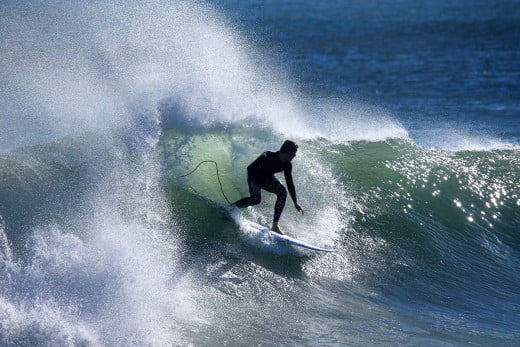 Surfer at Rocky Point, Surf Highway 45, Taranaki/New Plymouth, New Zealand. 