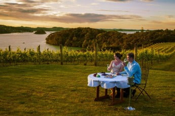 Couple dining at Omata Estate Vineyard, Northland. 