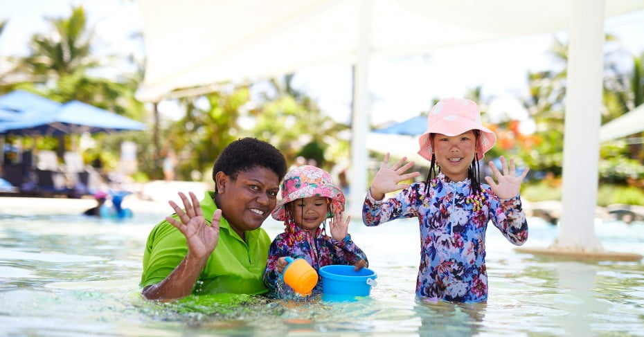 Kids having water-fun, Fiji. 