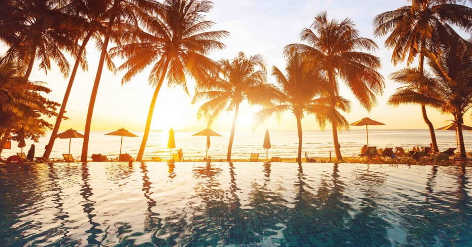 Fiji sunset pool and palm trees. 