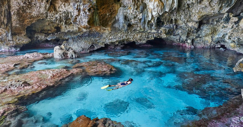 Snorkelling in rocky pool, Niue, Pacific Islands. 
