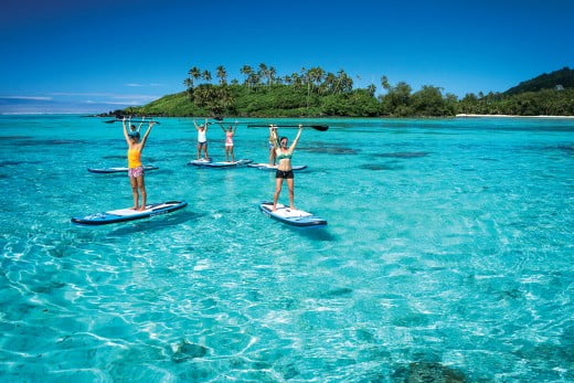 Paddleboarders at daytime, Rarotonga, Cook Islands. 