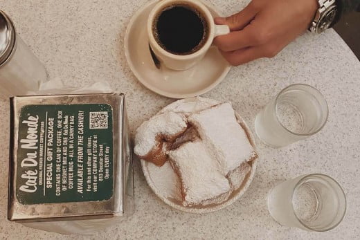 Beignets and coffee at Cafe du Monde, New Orleans. 