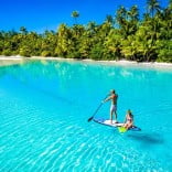 Couple on a paddleboard, Cook Islands