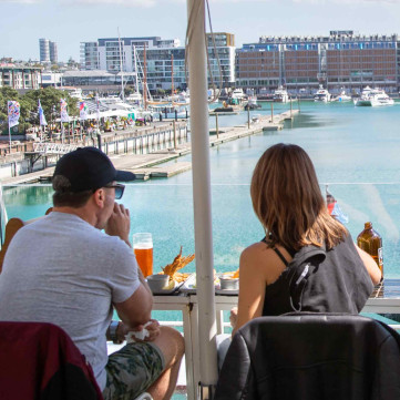 couple looking out at the Rudis Viaduct Harbour